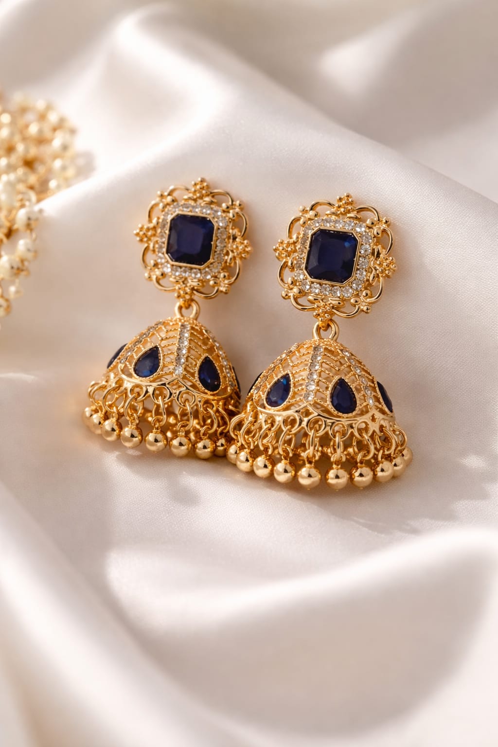 Luxury Gold Plated Jhumka Earrings with Blue Sapphire Stones